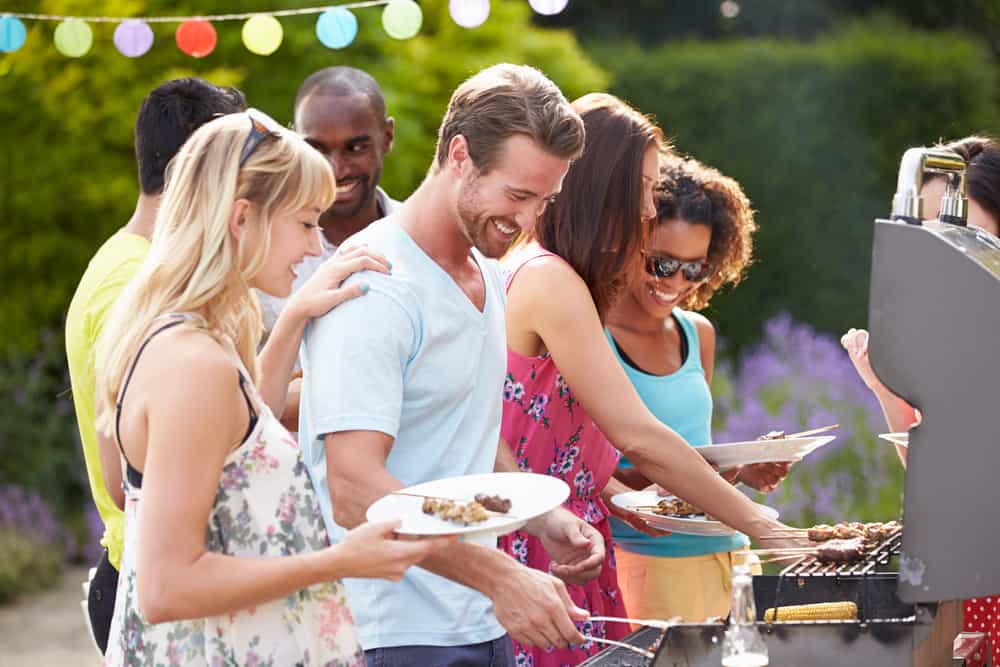 Group of young people enjoying a barbecue